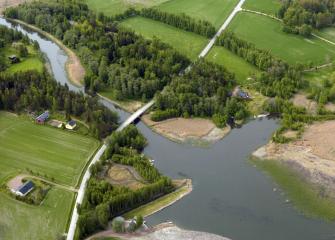Green fields and a river.